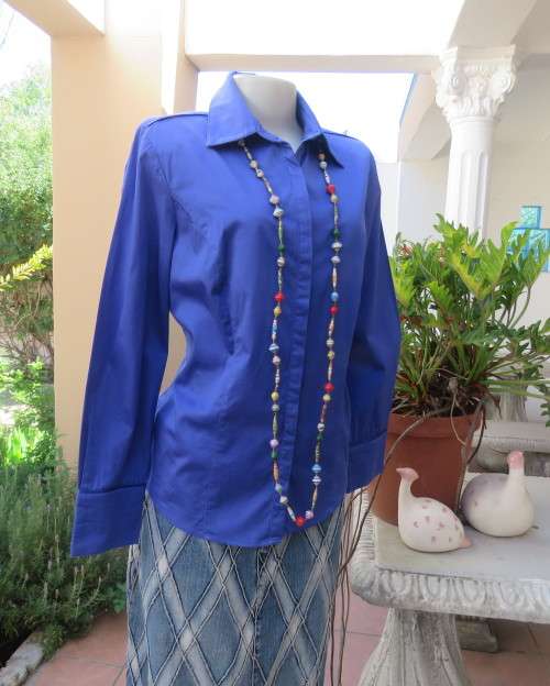 High quality long sleeve royal blue top by STUDIO W size 38/14.Hidden button down and shirt collar.