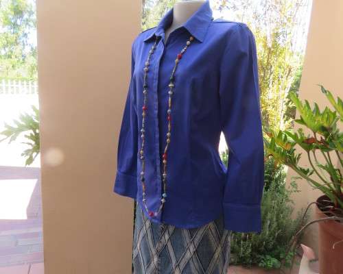 High quality long sleeve royal blue top by STUDIO W size 38/14.Hidden button down and shirt collar.