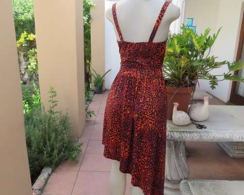 Get noticed in this brick and black high/low animal print poly stretch dress.By WWW size 36.
