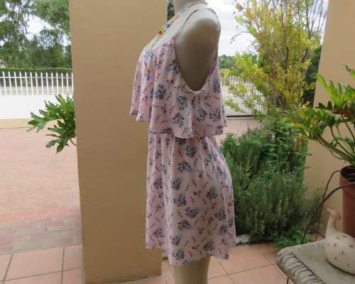Cute little strappy dress in pale pink/white with red/blue tiny flowers.Size 38.With top overlay