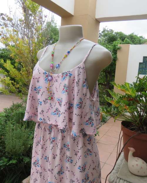 Cute little strappy dress in pale pink/white with red/blue tiny flowers.Size 38.With top overlay