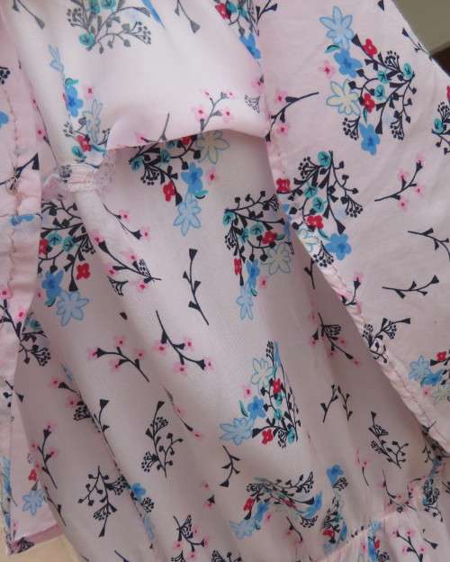 Cute little strappy dress in pale pink/white with red/blue tiny flowers.Size 38.With top overlay