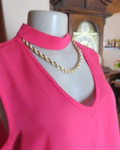 Sweet crimson pink slip over top with V front and banded collar.Size 38/14.Slit at back with buttons