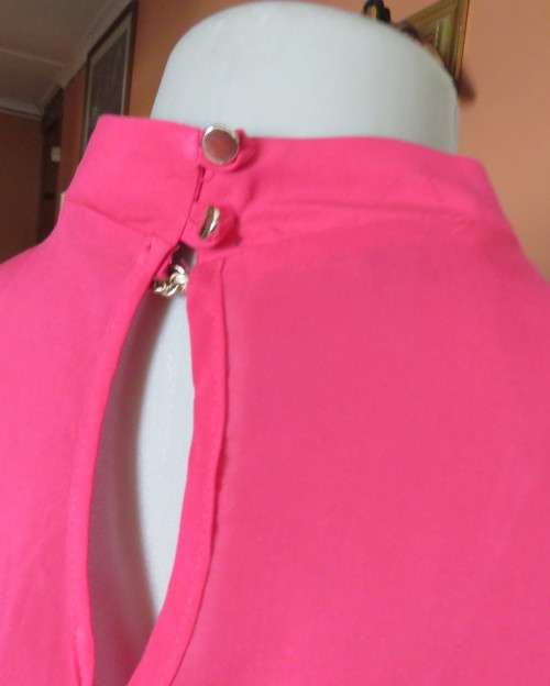 Sweet crimson pink slip over top with V front and banded collar.Size 38/14.Slit at back with buttons