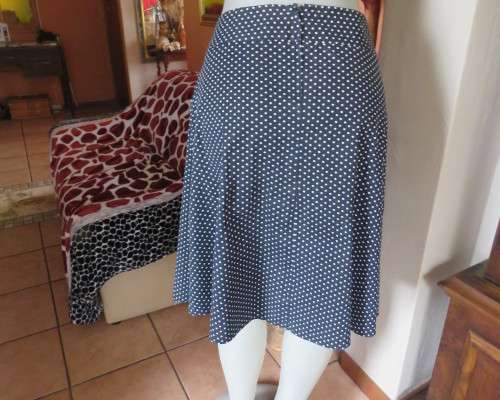 Easy to wear black A-Line calf length skirt with white polkadots.Yoke style waistband.Size 40/16.