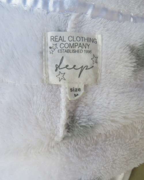 Warm and cost ladies hooded onesie pajamas in white with star pattern.Size 34 to 36.New condition.