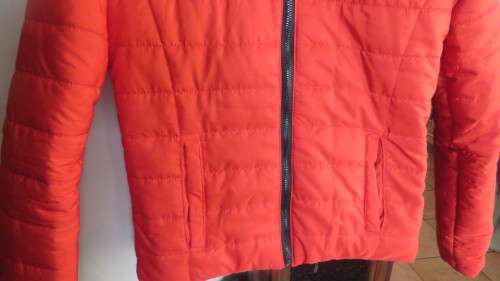 As new red padded long sleeve hooded jacket size 30/6 by RT. Kangaroo pockets.100% polyester.