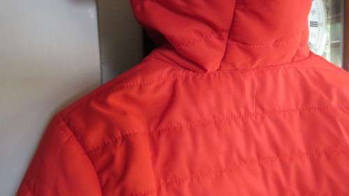 As new red padded long sleeve hooded jacket size 30/6 by RT. Kangaroo pockets.100% polyester.
