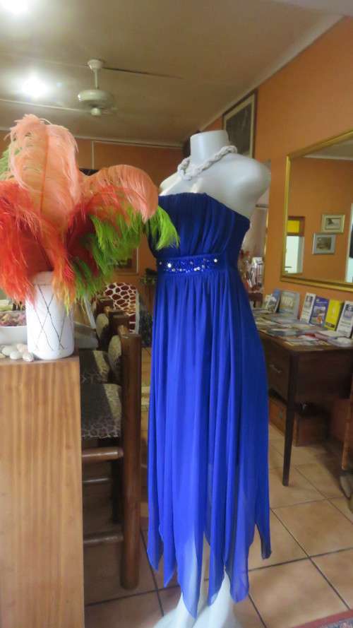 Hot strapless royal blue evening dress.Sheer overskirt.Ruched in top.Embellished.Size 32.Truworths.