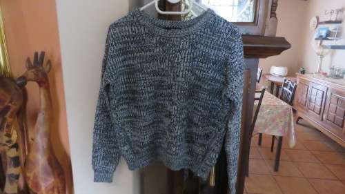 Soft cosy acrylic knit long sleeve jumper in black/white mottled look.Two short zips.Size 34  As new