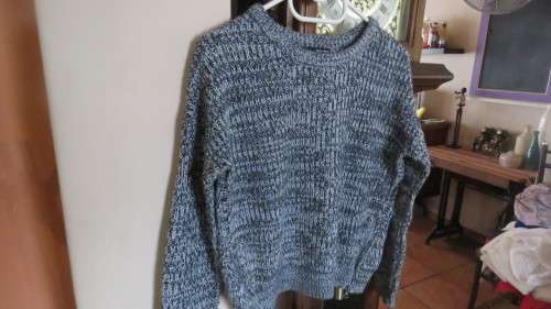 Soft cosy acrylic knit long sleeve jumper in black/white mottled look.Two short zips.Size 34  As new