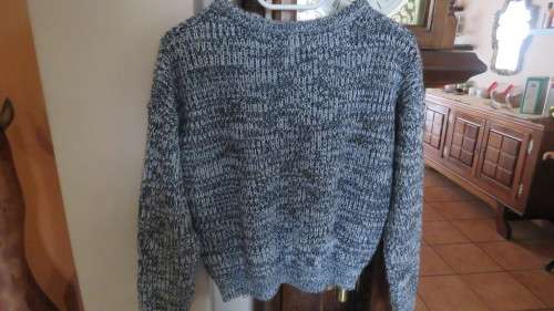 Soft cosy acrylic knit long sleeve jumper in black/white mottled look.Two short zips.Size 34  As new