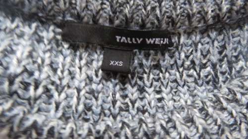 Soft cosy acrylic knit long sleeve jumper in black/white mottled look.Two short zips.Size 34  As new