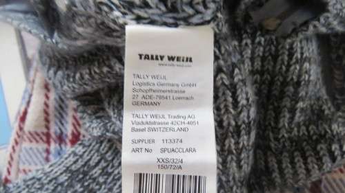 Soft cosy acrylic knit long sleeve jumper in black/white mottled look.Two short zips.Size 34  As new