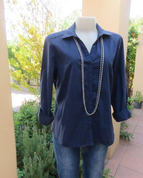 As new navy polycotton stretch long sleeve shirt.Skyblue polkadots.Open collar.Size 38 by MILADY`S