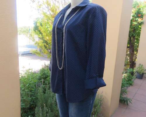 As new navy polycotton stretch long sleeve shirt.Skyblue polkadots.Open collar.Size 38 by MILADY`S