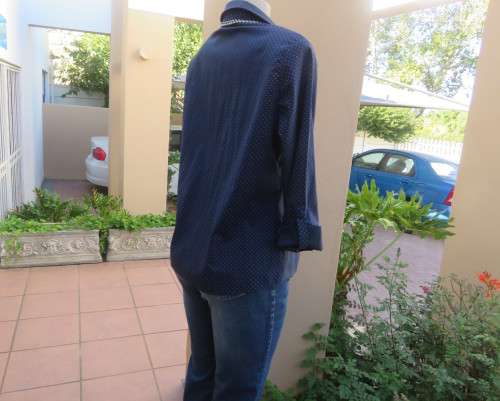 As new navy polycotton stretch long sleeve shirt.Skyblue polkadots.Open collar.Size 38 by MILADY`S