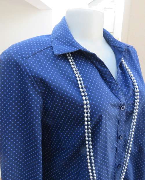 As new navy polycotton stretch long sleeve shirt.Skyblue polkadots.Open collar.Size 38 by MILADY`S
