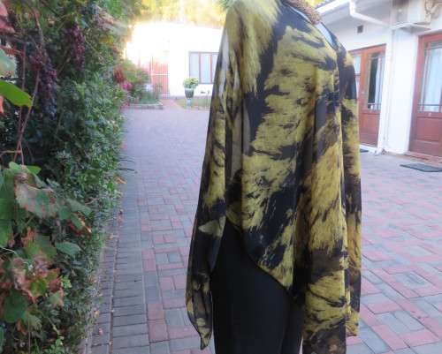 Stunning throw over top in black and mustard sheer polyester. Neckline edged with black satin.As new