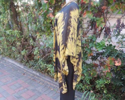 Stunning throw over top in black and mustard sheer polyester. Neckline edged with black satin.As new