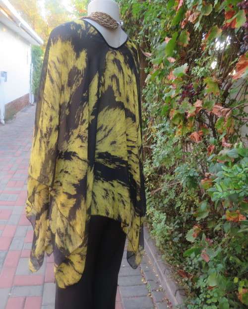 Stunning throw over top in black and mustard sheer polyester. Neckline edged with black satin.As new