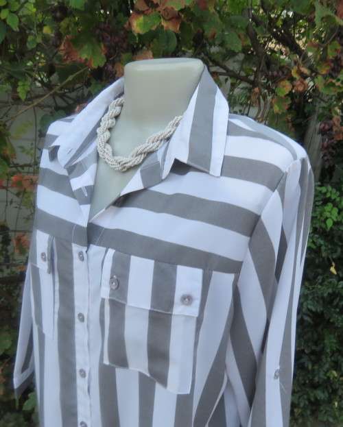 Fabulous extra long top/shirt in grey/white vertical stripes. Yoked. Elbow length sleeves.Size 40/16