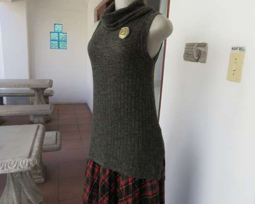 Fabulous olive green poloneck long knitted top in viscose/poly stretch.Size 34 to 36.By COTTON ON.