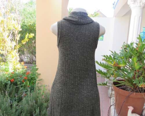 Fabulous olive green poloneck long knitted top in viscose/poly stretch.Size 34 to 36.By COTTON ON.