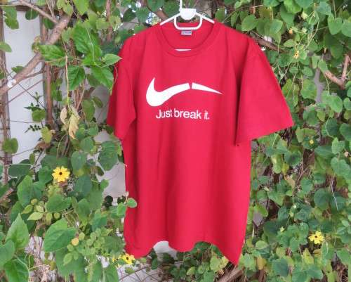 Men`s red ANURUK short sleeve T Shirt from Thailand in 100% cotton. White logo. New condition.
