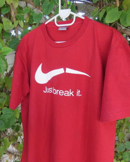 Men`s red ANURUK short sleeve T Shirt from Thailand in 100% cotton. White logo. New condition.