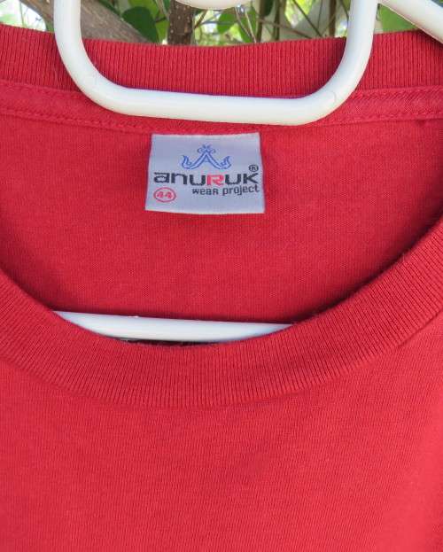 Men`s red ANURUK short sleeve T Shirt from Thailand in 100% cotton. White logo. New condition.