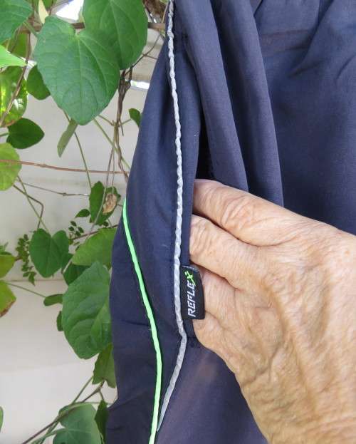 Men`s navy polyester tracksuit pants with green edging size Medium by REFLEX.Zips on leg seams.