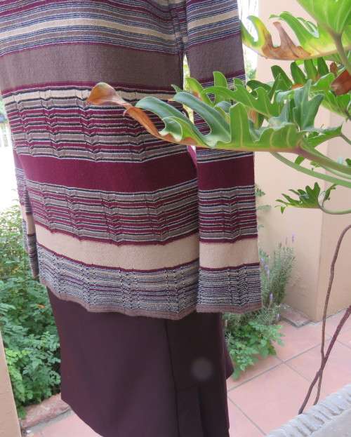 Smart long knitted pullover top in maroon,brown,cream and gold thread acrylic/polyester.Size 38/14.