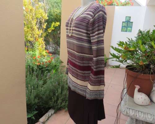 Smart long knitted pullover top in maroon,brown,cream and gold thread acrylic/polyester.Size 38/14.