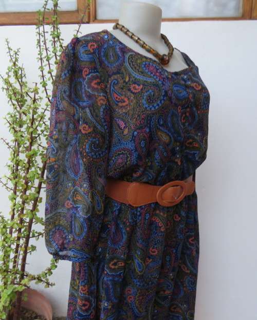 Marvelous sheer polyester lined slip over dress in blues,peach and gold paisley pattern.Size 38/14