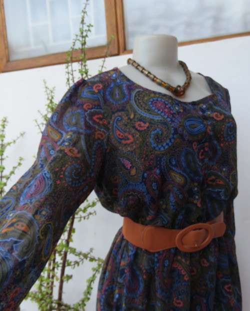 Marvelous sheer polyester lined slip over dress in blues,peach and gold paisley pattern.Size 38/14