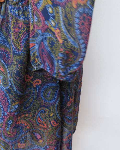 Marvelous sheer polyester lined slip over dress in blues,peach and gold paisley pattern.Size 38/14