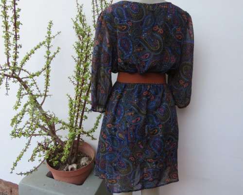 Marvelous sheer polyester lined slip over dress in blues,peach and gold paisley pattern.Size 38/14