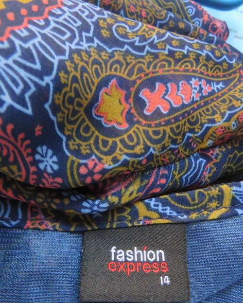 Marvelous sheer polyester lined slip over dress in blues,peach and gold paisley pattern.Size 38/14