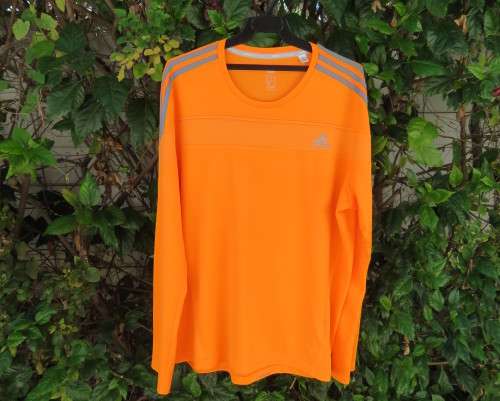 Striking original ADIDAS running slip over long sleeve top in orange polyester size XL.As new