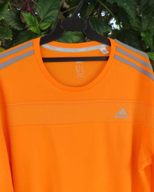 Striking original ADIDAS running slip over long sleeve top in orange polyester size XL.As new