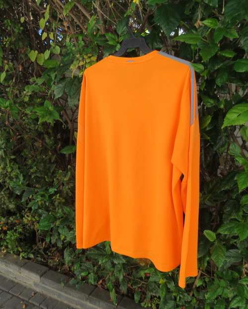 Striking original ADIDAS running slip over long sleeve top in orange polyester size XL.As new