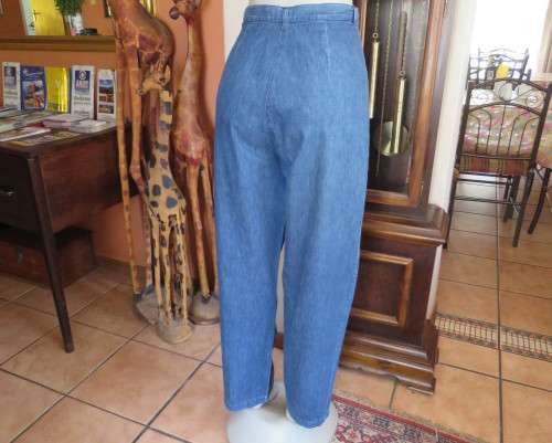 Vintage 80`s high waisted blue denim jeans with wide legs tappered.Size 38 to40.V yoke pleated front