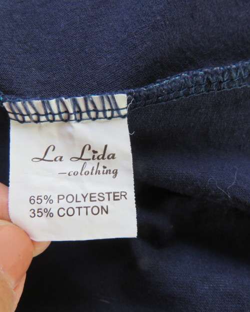 Delightful long navy top with maroon bust area. With Afrikaans logos and pictures.Size 34.As new