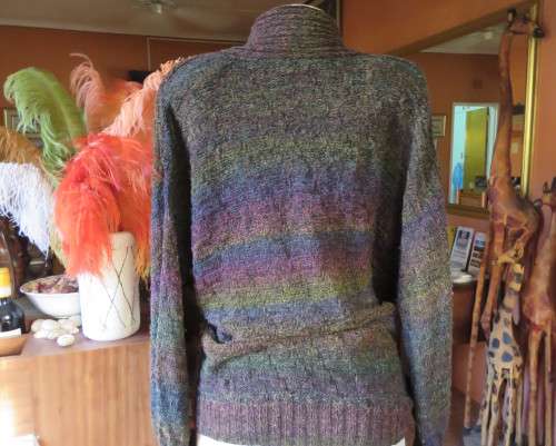 Warm acrylic knit dark jewel colour long sleeve cardigan.Double breast. Size 42 to 44.Very good cond