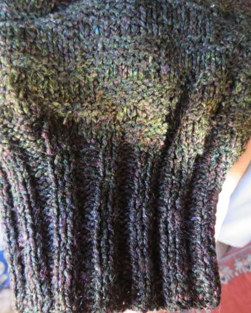 Warm acrylic knit dark jewel colour long sleeve cardigan.Double breast. Size 42 to 44.Very good cond