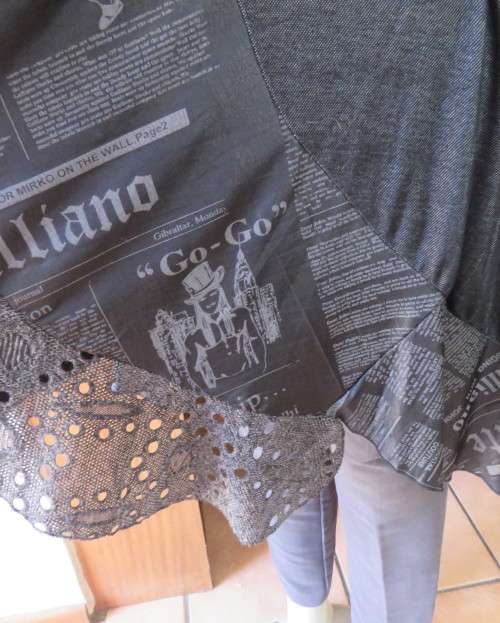 Sexy,shiny black long top with scooped neckline.Size 38/14.Circle panels in lace and poly.As new