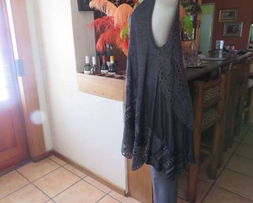 Sexy,shiny black long top with scooped neckline.Size 38/14.Circle panels in lace and poly.As new