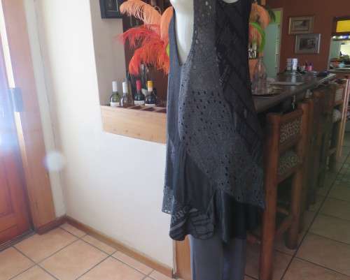 Sexy,shiny black long top with scooped neckline.Size 38/14.Circle panels in lace and poly.As new