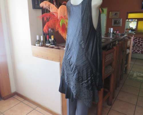 Sexy,shiny black long top with scooped neckline.Size 38/14.Circle panels in lace and poly.As new